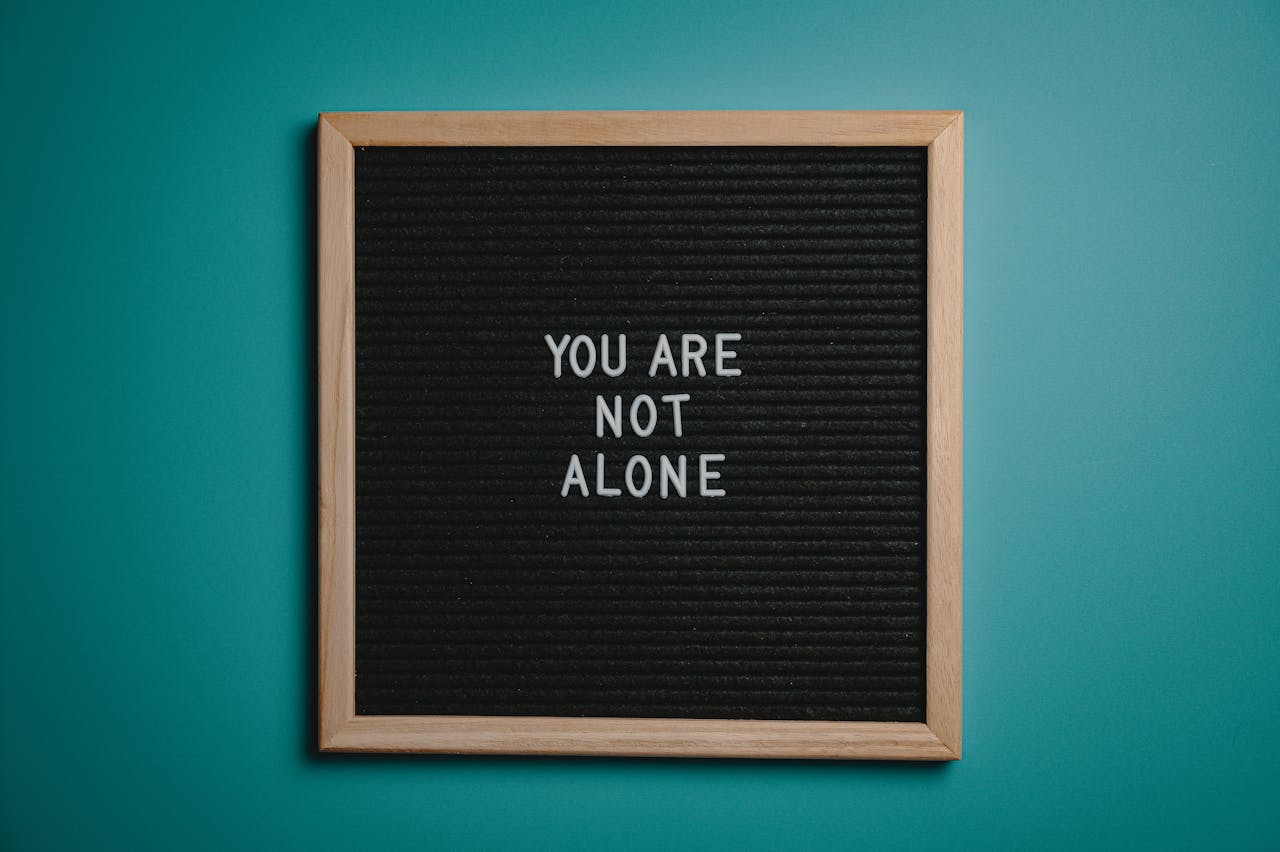 gallery-1 A wooden letter board displays a motivational message against a teal background.