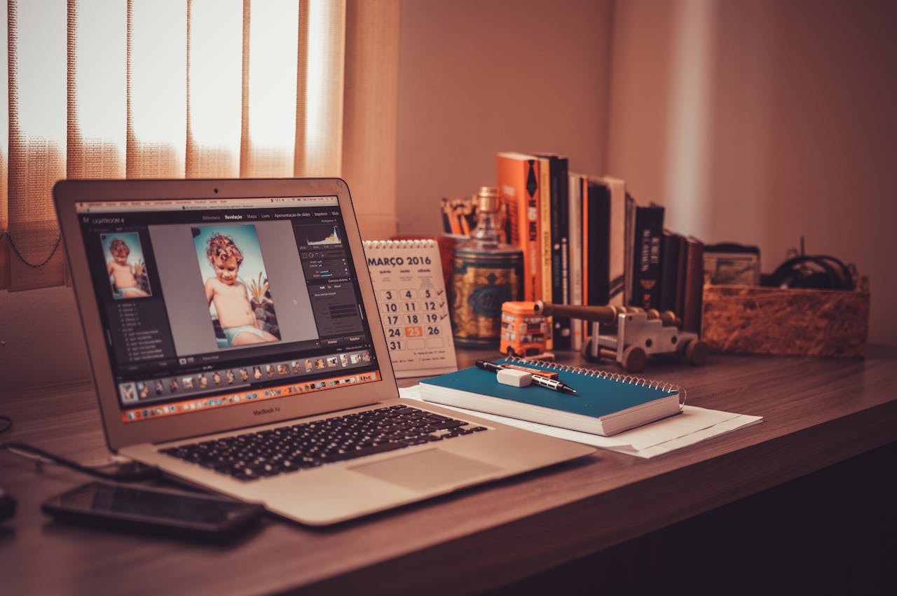 our-services-1 Warm-toned home office desk with a laptop, notebook, and books. Perfect for freelancers.